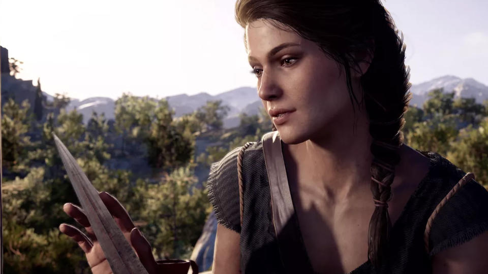 A protagonist of Assassin's Creed: Odyssey, Kassandra, gently holding a knife.
