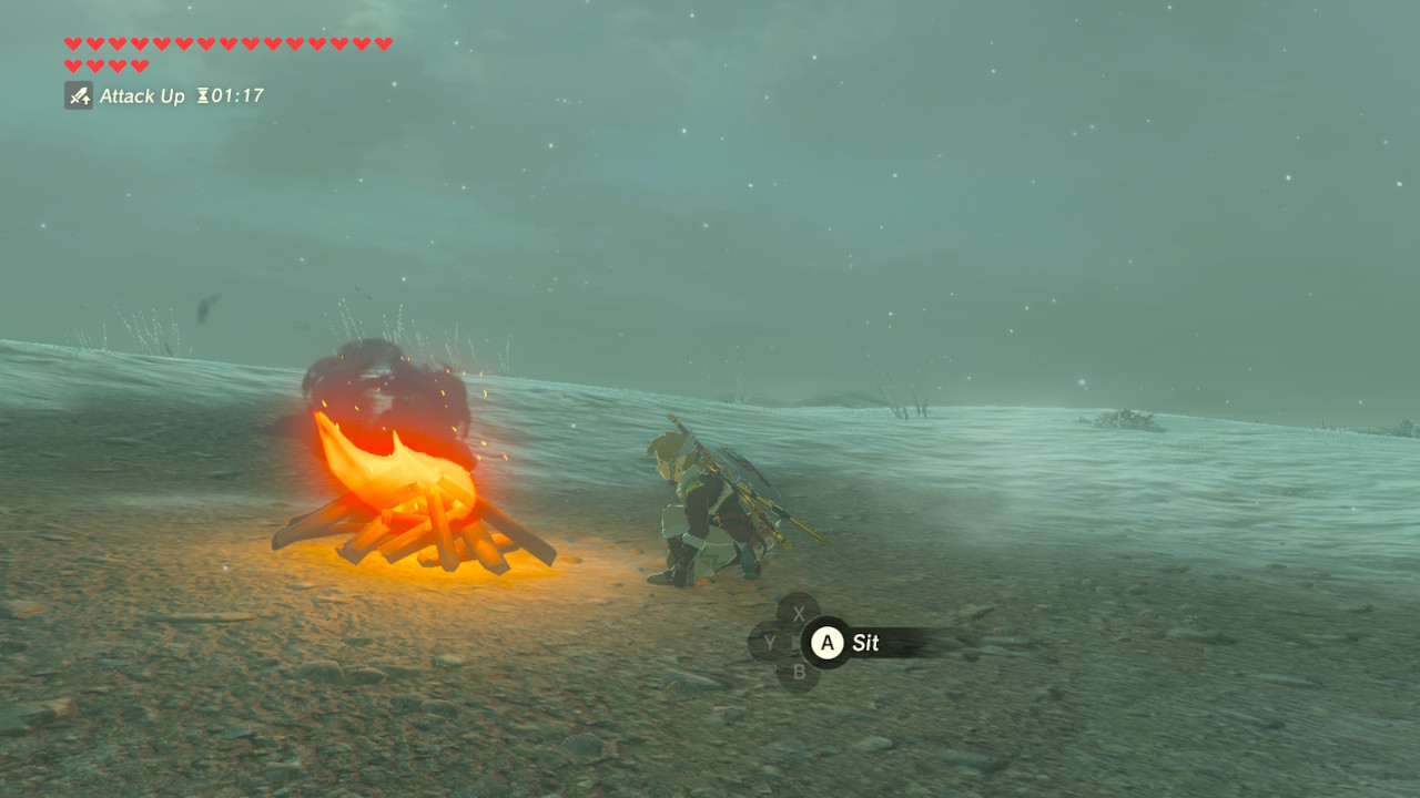 The Legend of Zelda: Breath of the Wild features Link crouching beside a glowing campfire in a snowy field. Screenshot by author.