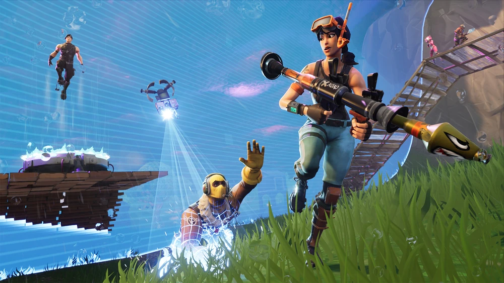 Fortnite characters battle near a blue storm wall, with a character wielding a rocket launcher in the foreground. Image courtesy of Epic Games.