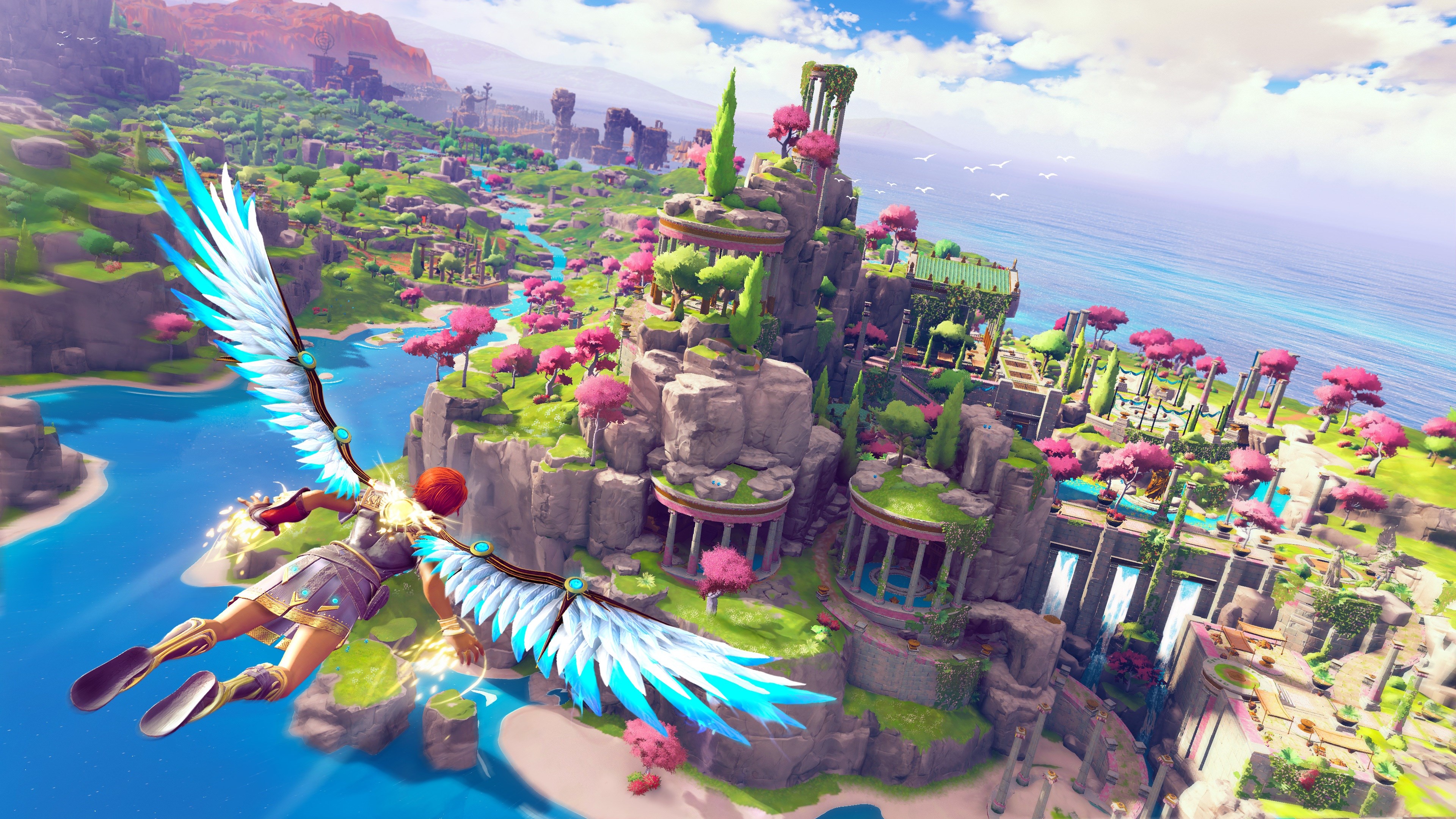 A screenshot from Immortals Fenyx Rising shows a winged character flying over a vibrant, colorful landscape with ancient Greek-style structures.