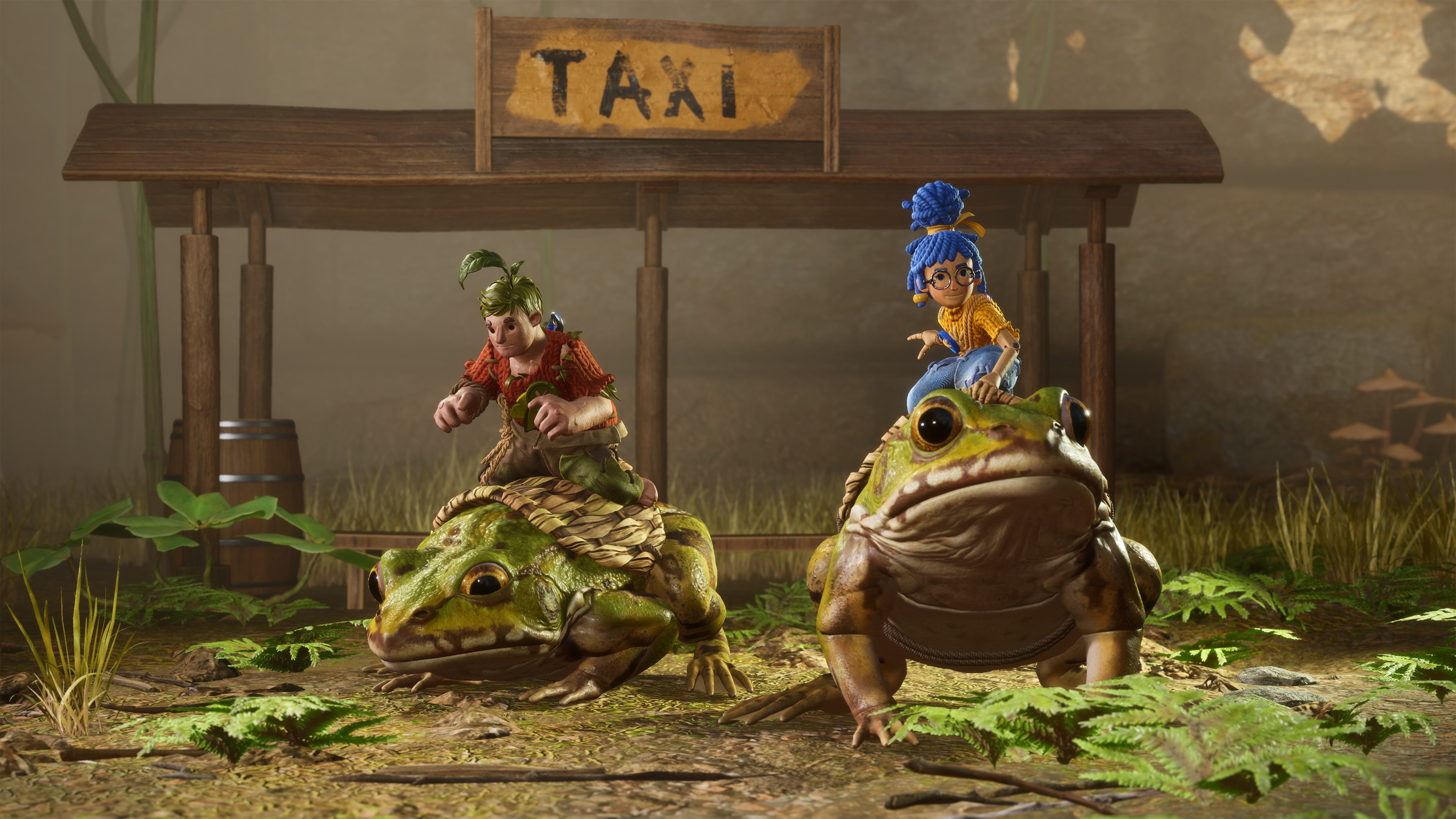 A screenshot from It Takes Two shows two small, doll-like characters riding on the backs of large frogs, with a "TAXI" sign in the background.
