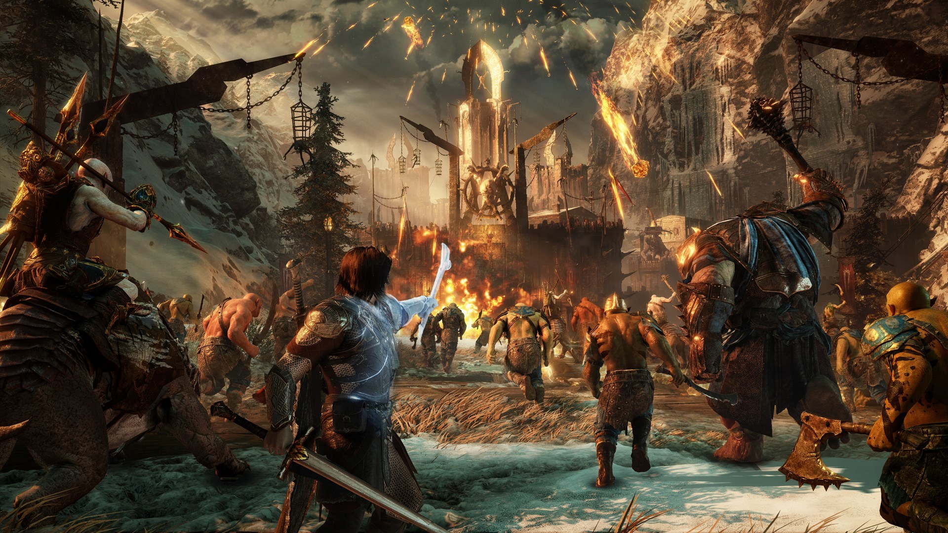 A screenshot from Middle-earth: Shadow of War depicts a chaotic battle scene with many orcs and a central character fighting amongst them.
