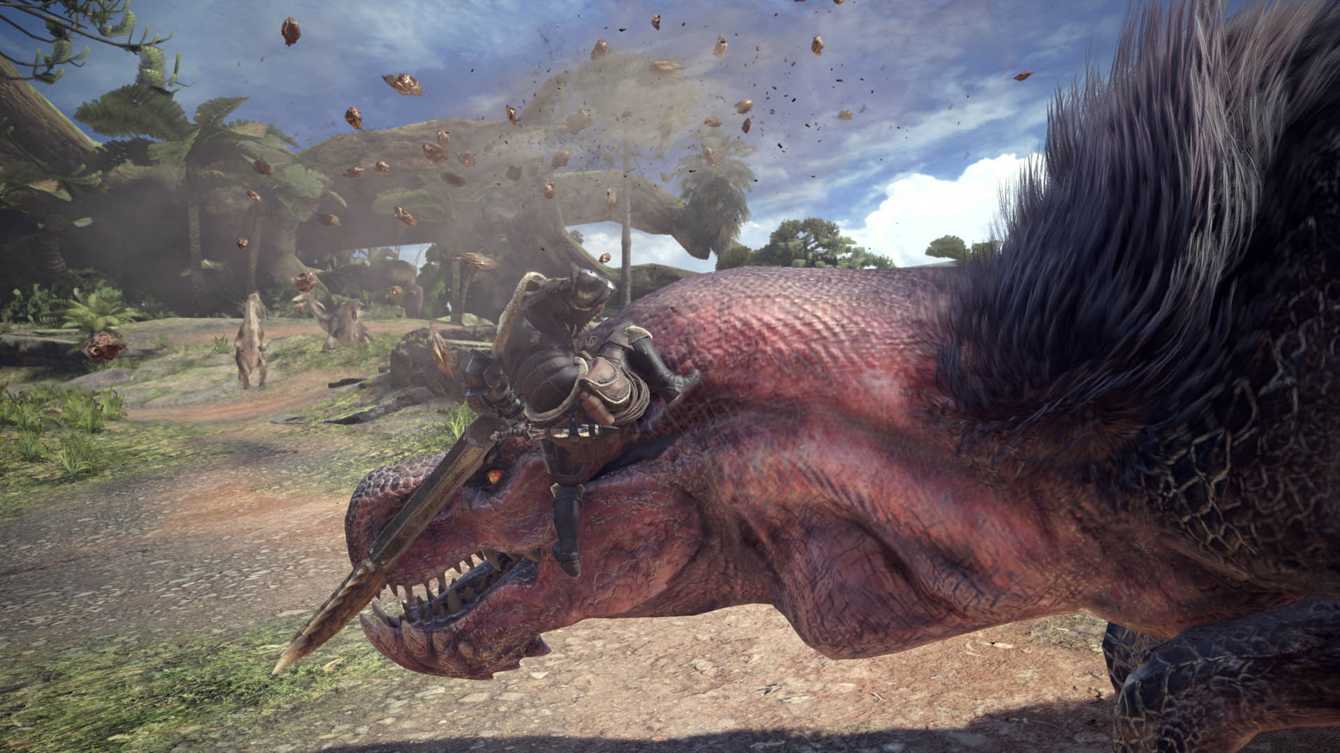 Monster Hunter World shows a player character riding a large, horned monster in a jungle environment, with small rocks flying in the air.