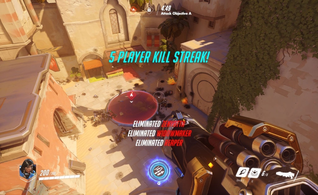 An Overwatch first-person view shows the player's weapon, a five-player kill streak, and the interface on a sunny map.