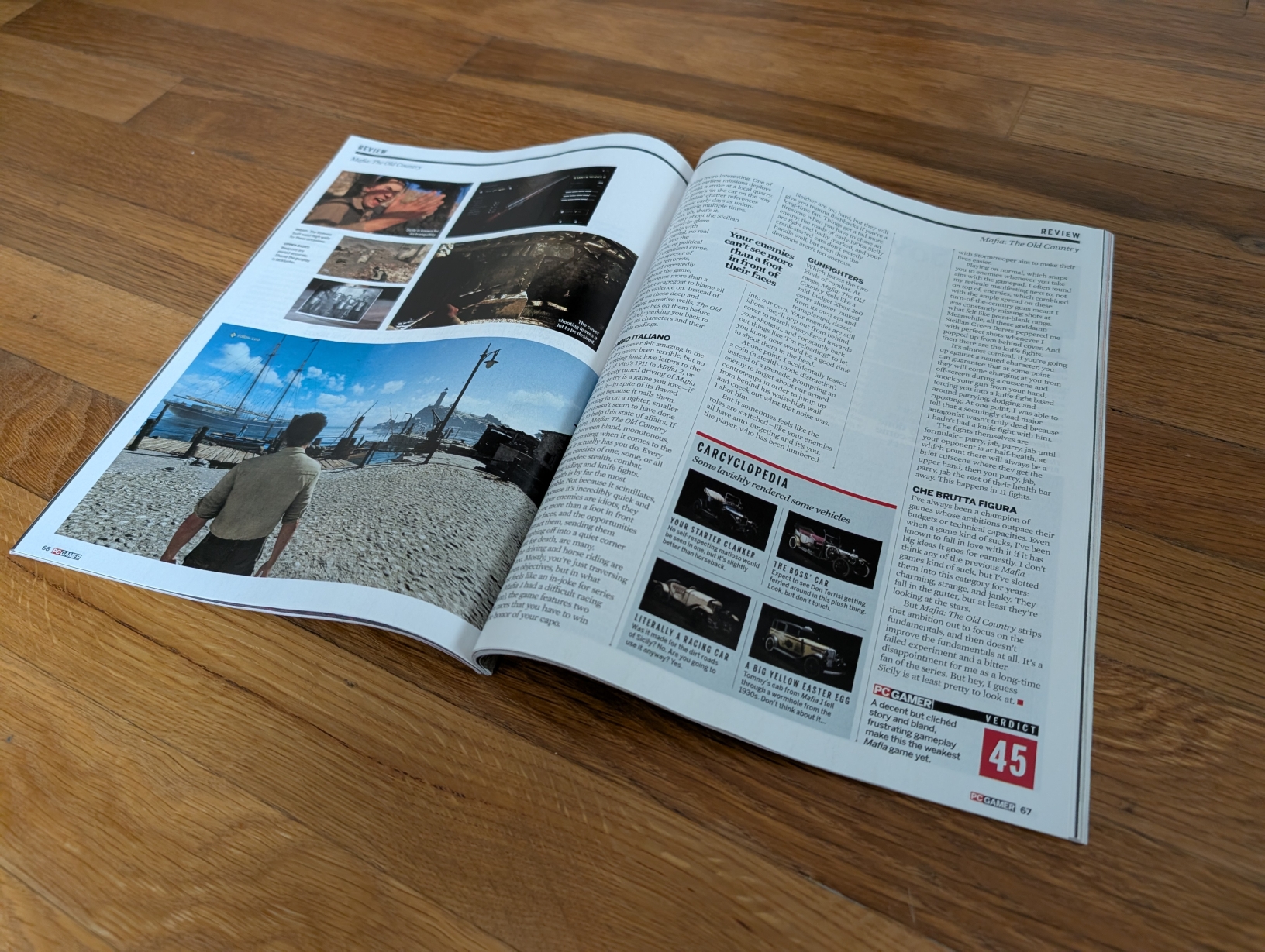 Open PC Gamer magazine on the floor, with illegible articles and screenshots.