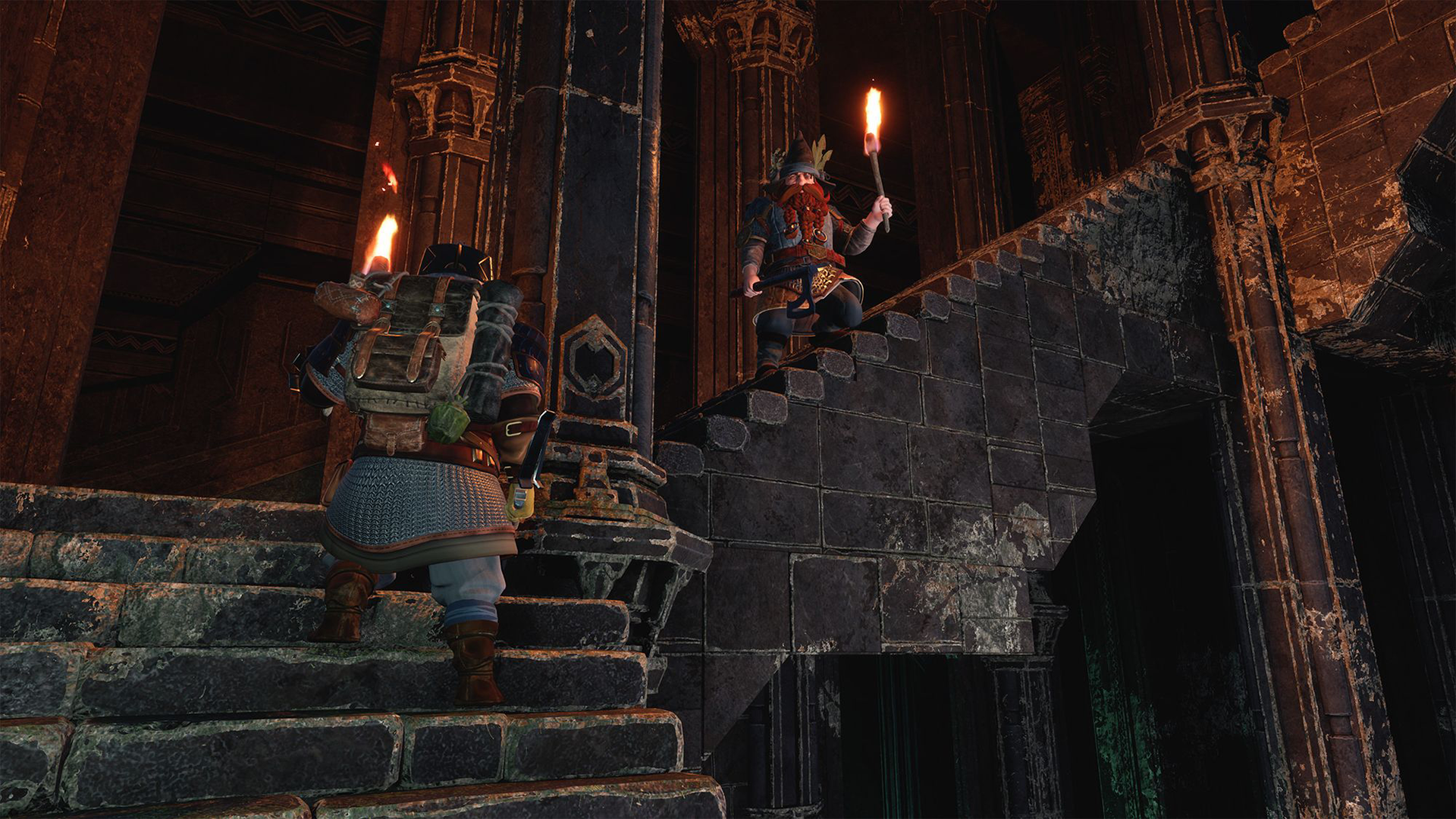 Two dwarves holding torches climbing a ruined staircase in Return to Moria. Image courtesy of Free Range Games.