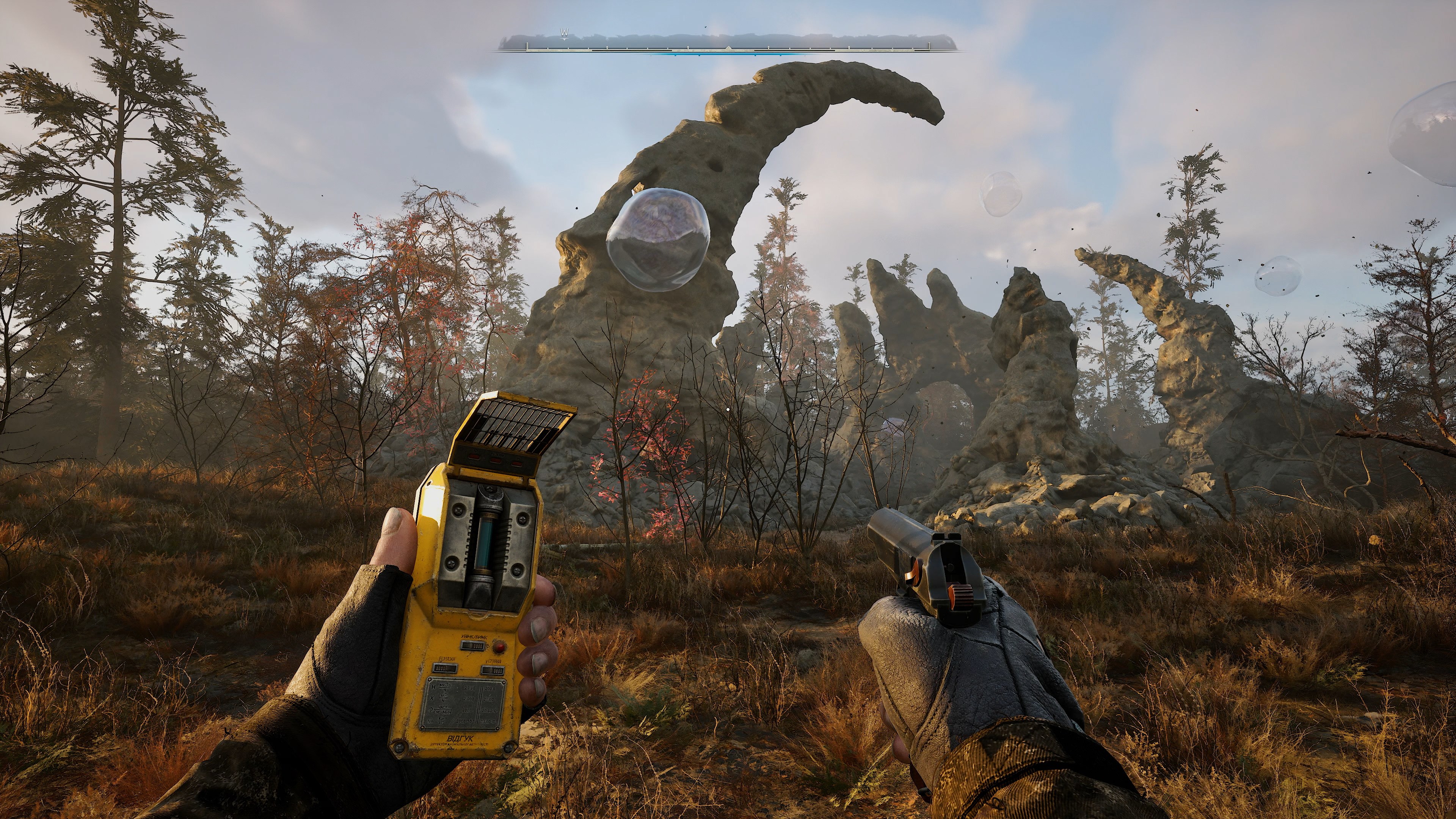 A screenshot from S.T.A.L.K.E.R. 2: Heart of Chernobyl shows a first-person view of a character holding an anomaly detector and a pistol in a desolate, overgrown environment with a large floating bubble anomaly ahead.