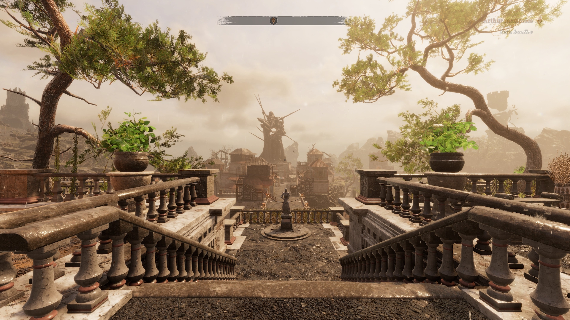 A view of a medieval city framed by trees with a massive statue in the background. Screenshot by author.