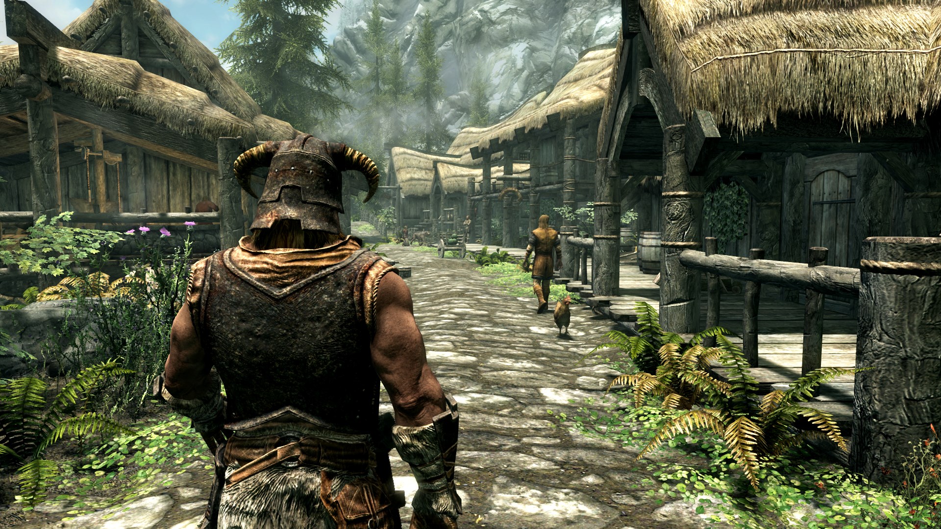 A screenshot from The Elder Scrolls V: Skyrim Special Edition shows a character in Viking-style armor walking through a rustic village.
