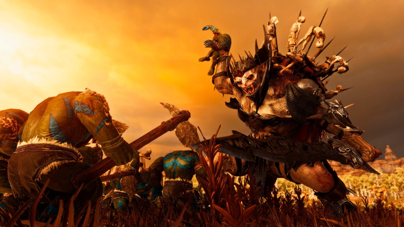 Total War: Warhammer III features a fierce hulking undead fighting against savage orcs.