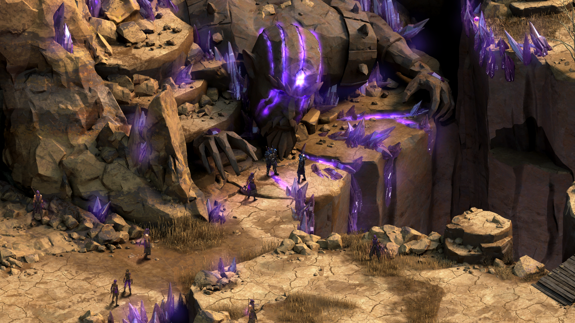 In Tyranny, characters stand on a rocky cliffside before a massive, cracked stone head glowing with purple energy. Image courtesy of Paradox Interactive.