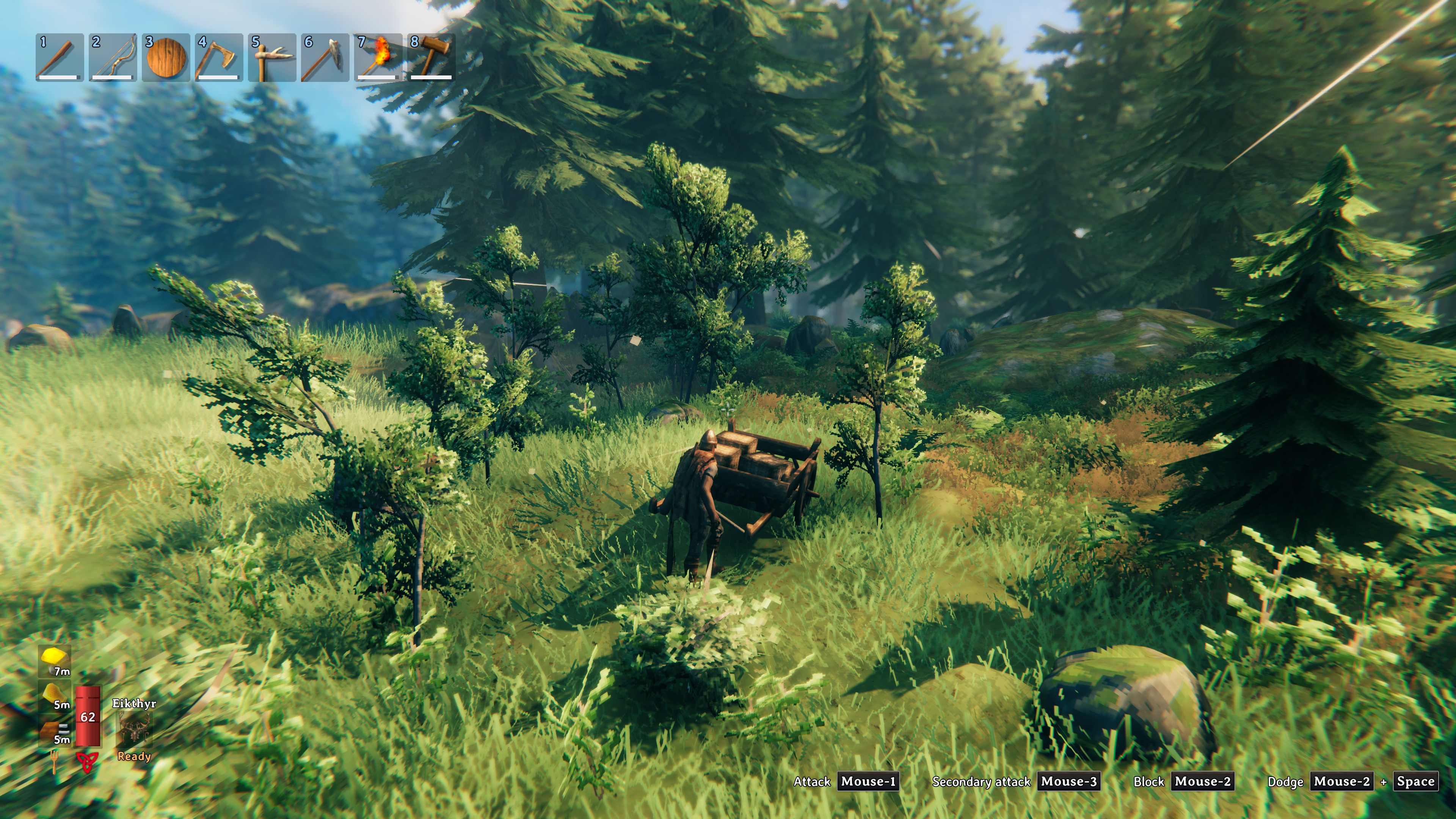 A player pushing a cart with materials in Valheim. Screenshot by author.