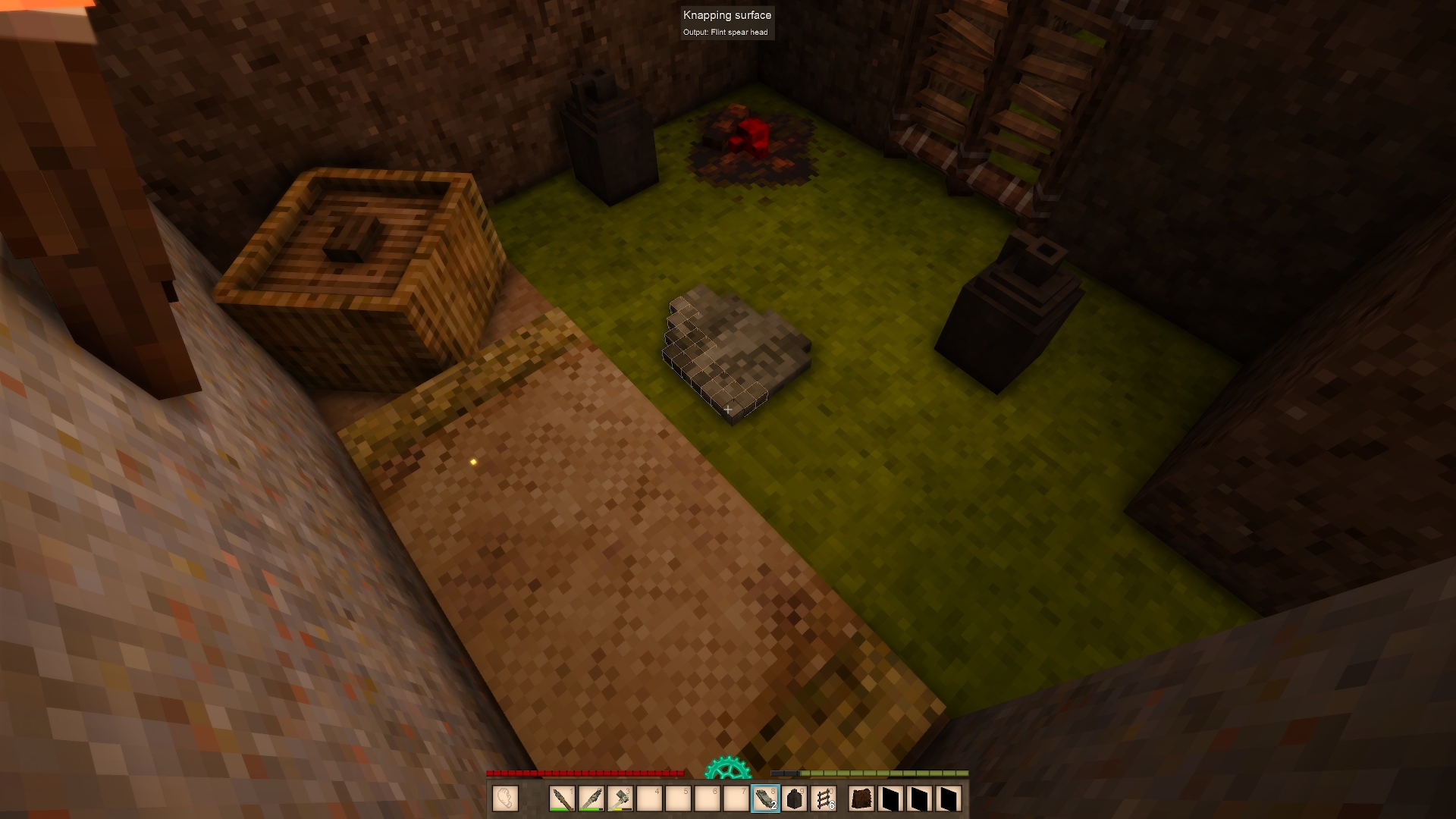 Vintage Story player knapping flint piece by piece inside a grass hut. Screenshot by author.