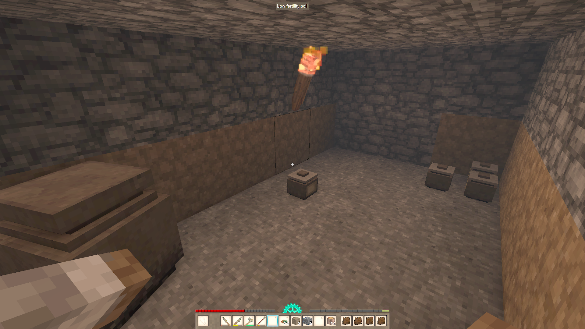 A larder in Vintage Story, a few small crocks and a grain vessel. Screenshot by author.